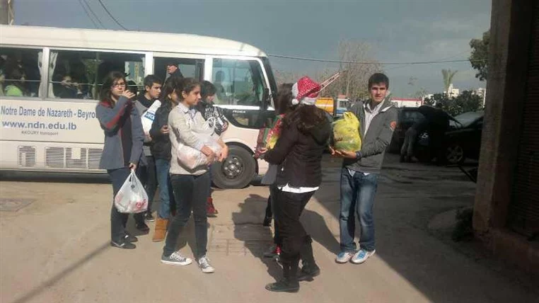 Nazareth Students visit BASSMA's Families at Christmas!